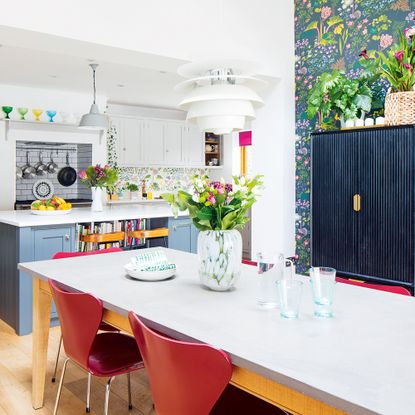 blue and grey kitchen with floral wallpaper