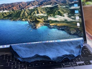 MacBook with cleaning wipe