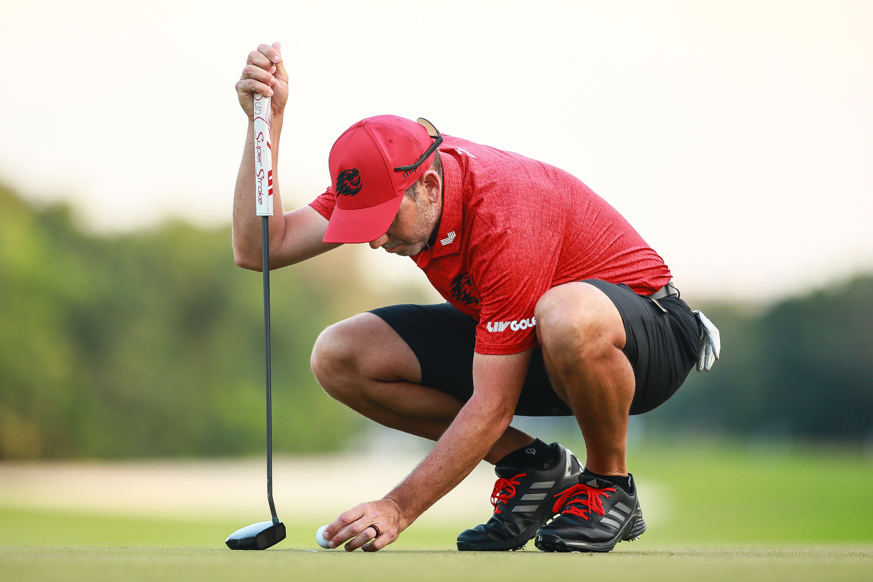 Sergio Garcia lines up a putt