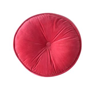 A round dark pink throw pillow with a tufted button
