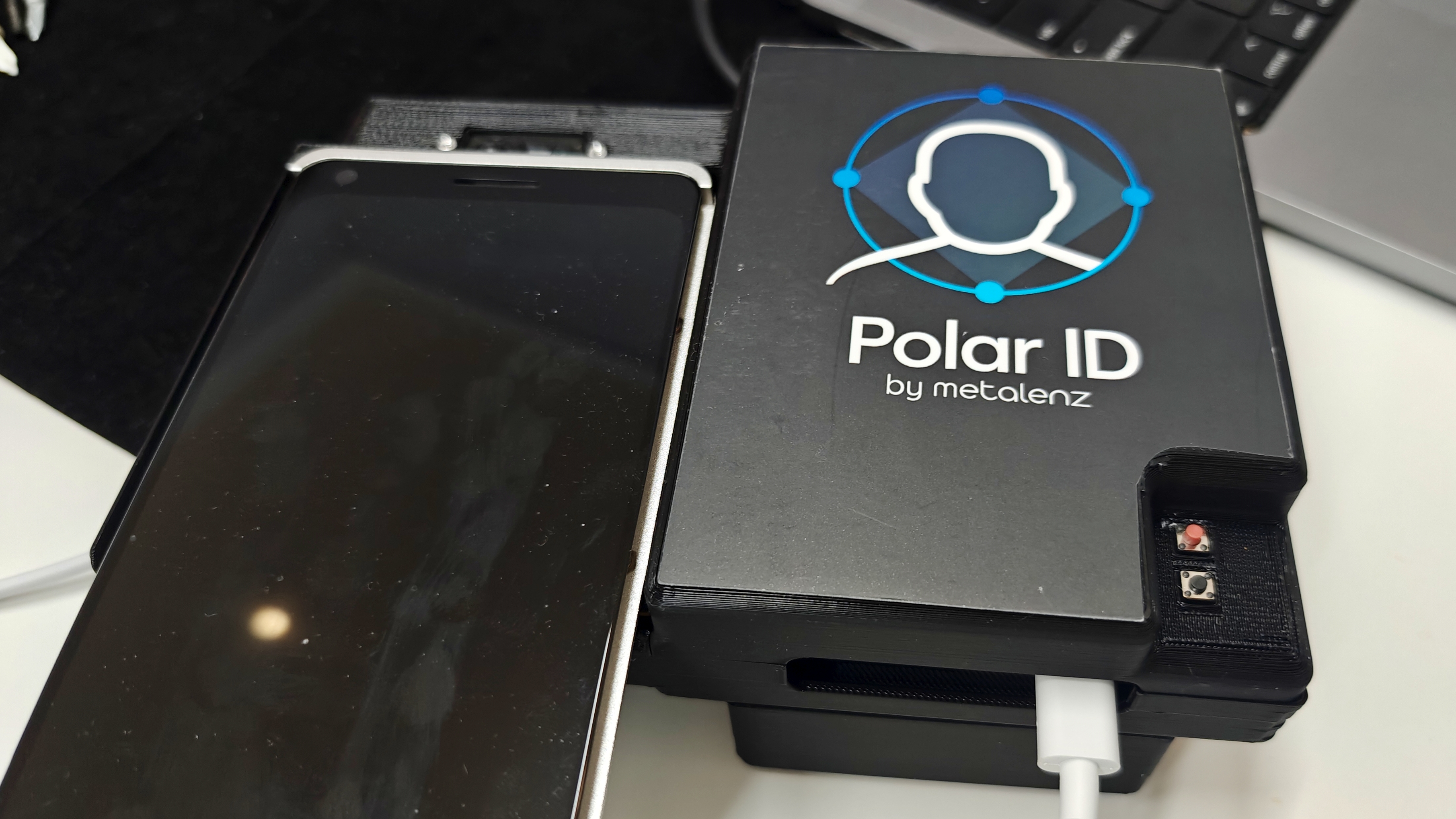 A demo smartphone for Polar ID attached to a black device