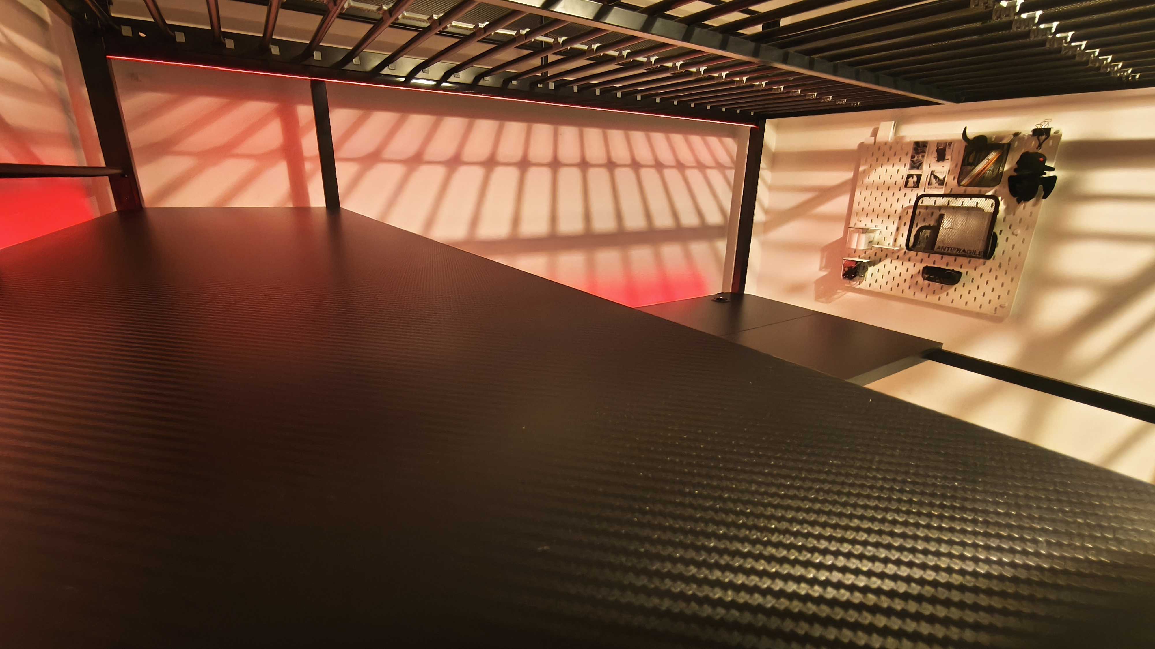 An assembled XRocker Battlebunk XL bed and desk combo inside a small bedroom