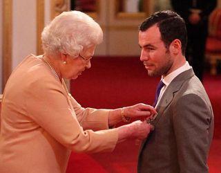 Cavendish receives his MBE from Queen Elizabeth II