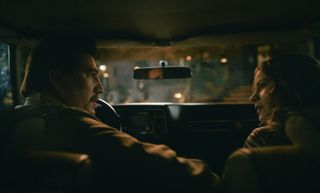 a man (Alberto Ammann as Alberto Bravo) and a woman (Sofia Vergara as Griselda) have a conversation in the interior of a car