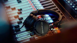 Beyerdynamic DT 275 Pro wired over-ear headphones on a mixing desk