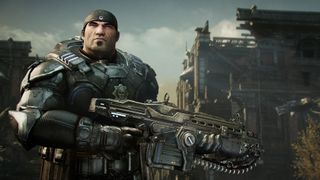 A stern, armored soldier grips a large futuristic rifle amid a devastated urban ruin, under a cloudy sky; the scene feels gritty and tense.