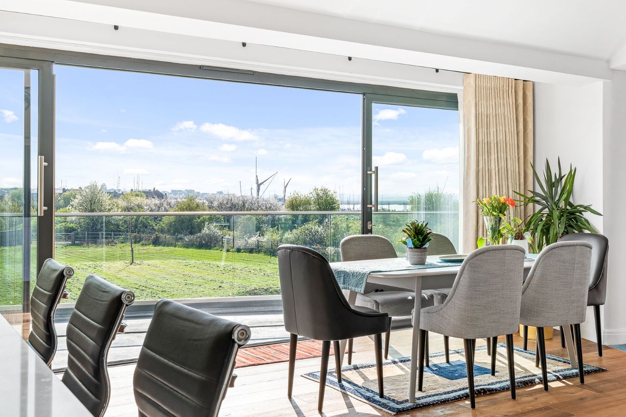 The kitchen-diner leads out onto the balcony via bifold doors which has views over the surrounding landscape