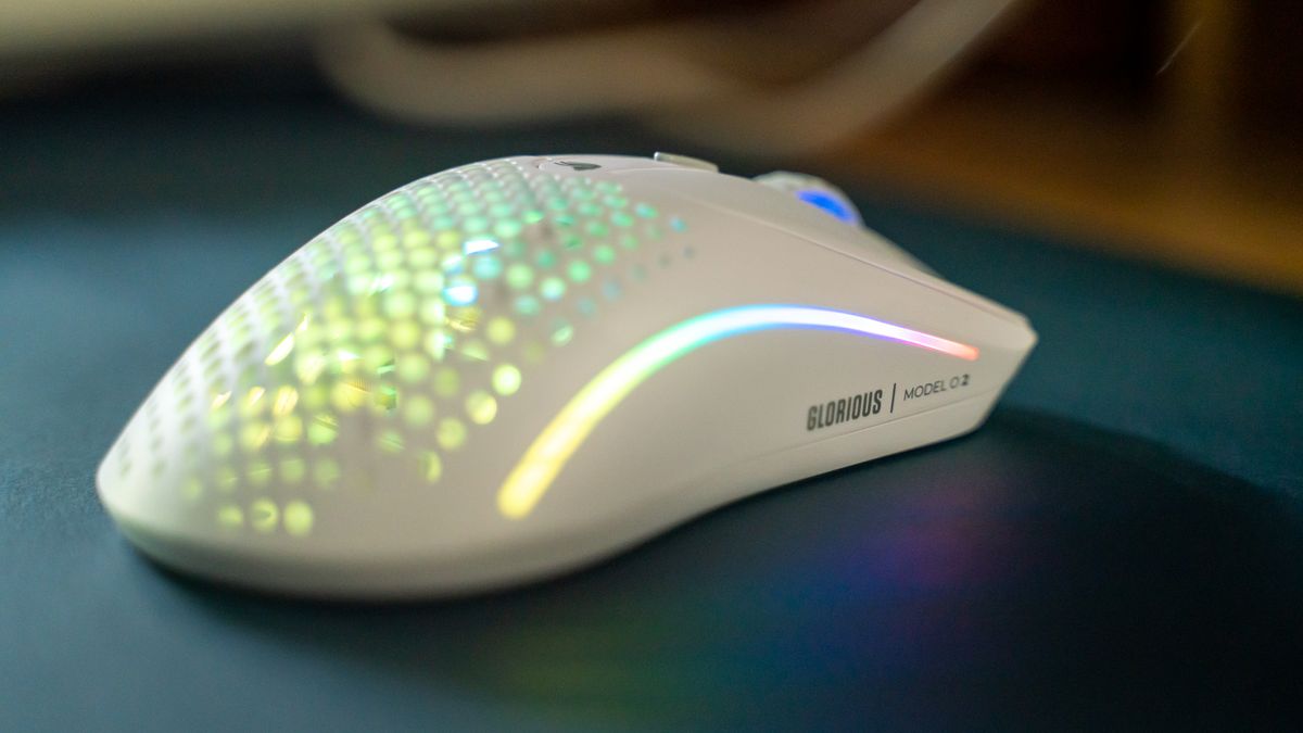 Glorious O2 Wireless on a dark blue desk pad