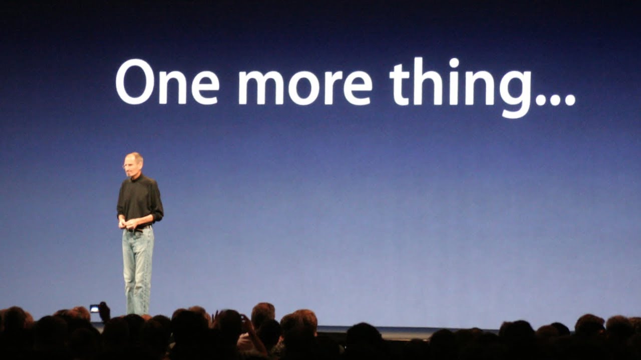 Steve Jobs standing in front of a screen reading 'One more thing'