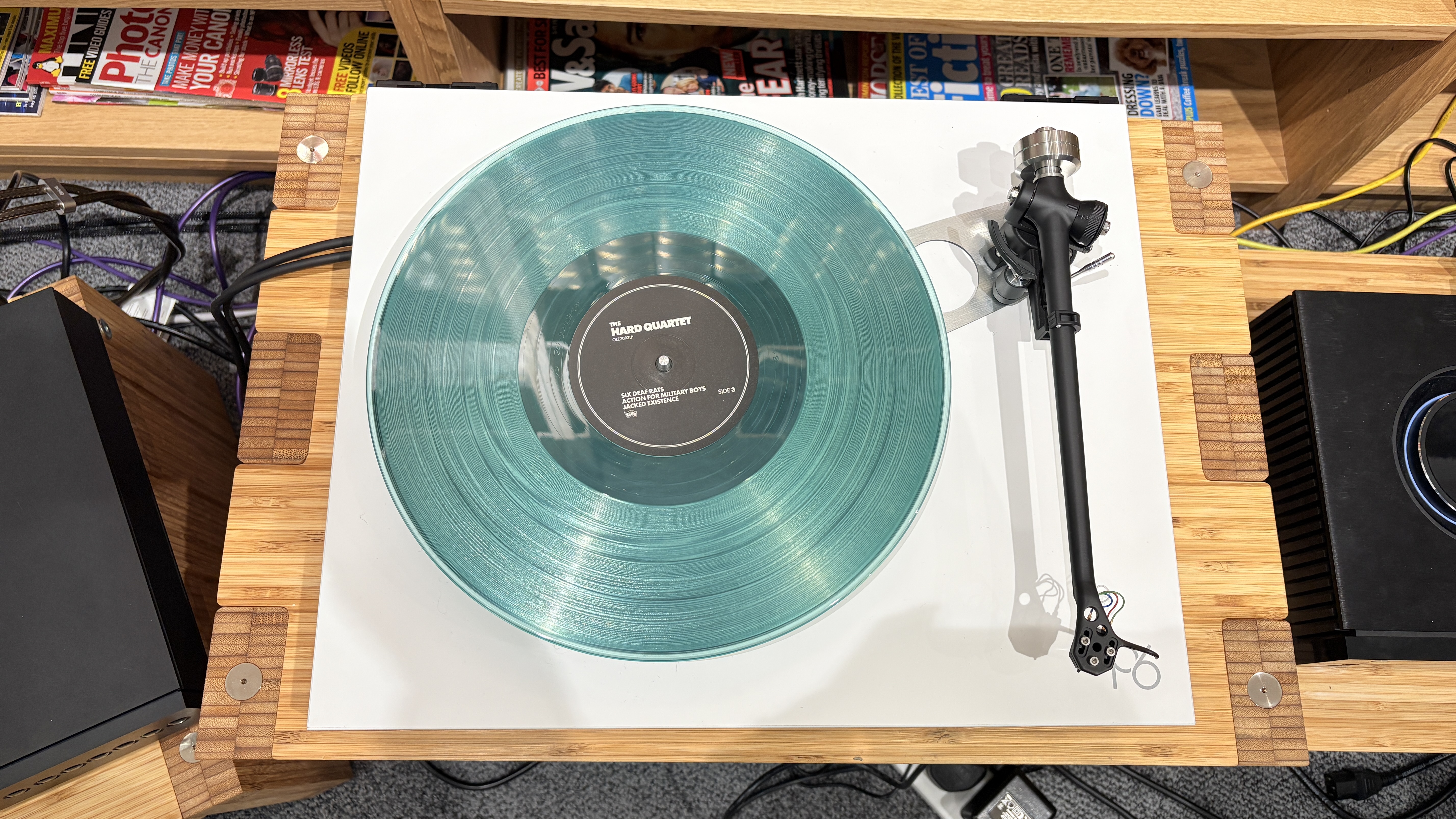 Rega Planar 6/Nd7 in white finish with blue vinyl record playing
