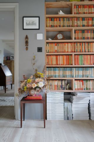 Penguin books on coordinated shelves by Christen Pears