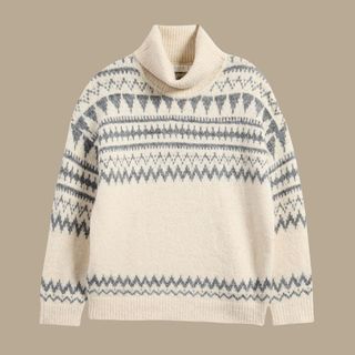 flat lay image of cream and grey jumper