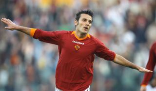 Vincenzo Montella does his trademark aeroplane celebration after scoring for Roma against Catania in 2006.