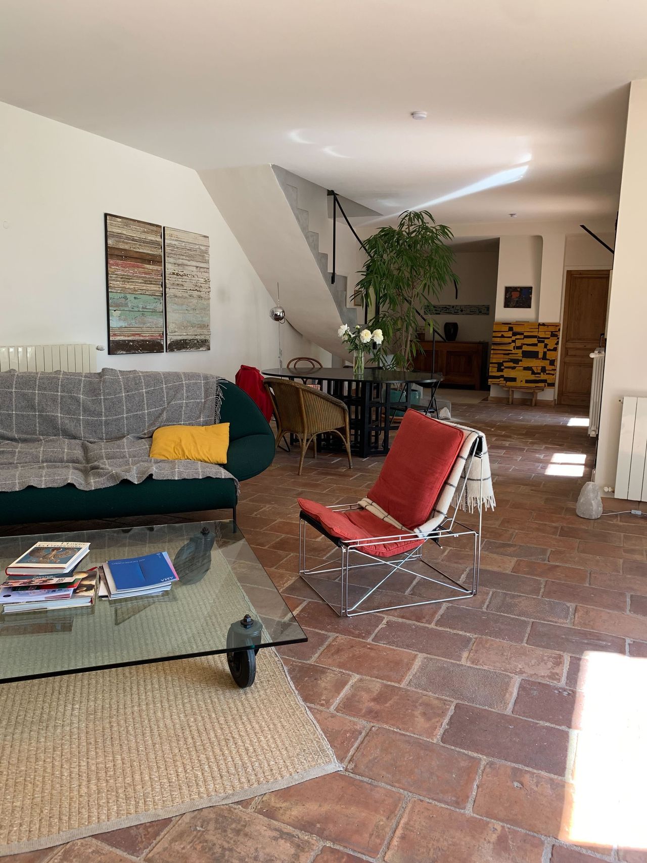 A series of images depicting the architectural, design, and nature standouts of Aix-en-Provence features picturesque alleys wrapped in vegetation, modernist interiors, and snapshots of food.