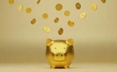 money going into golden piggy bank