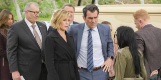 Claire and Phil Dunphy with their family in Modern Family.