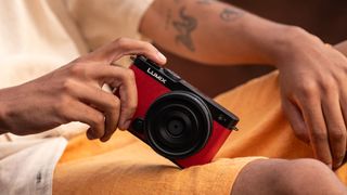 Panasonic Lumix S9 in Crimson Red color, in the hand