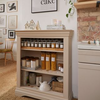 neutral kitchen with storage jars on shelves