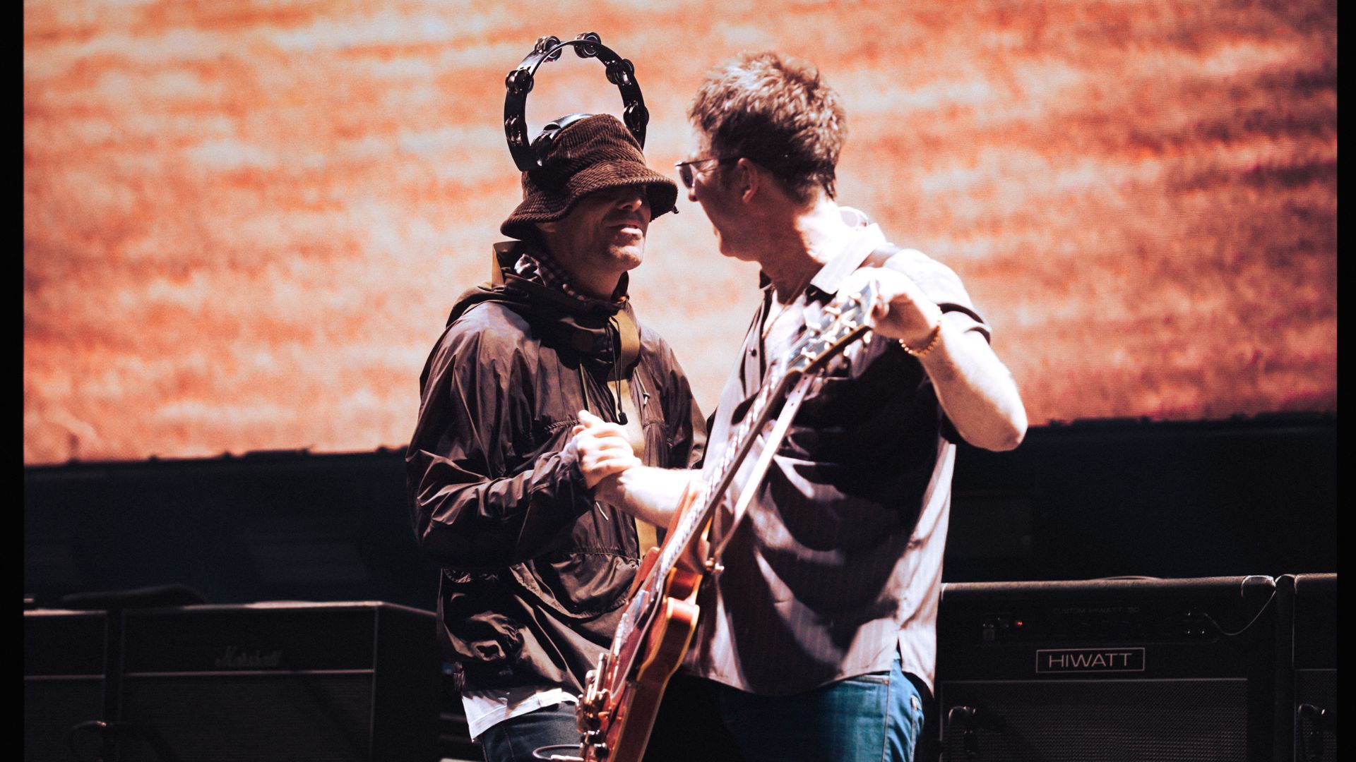 an image of the duo performing on stage during Live 25