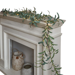 Fireplace mantel with light up olive garland