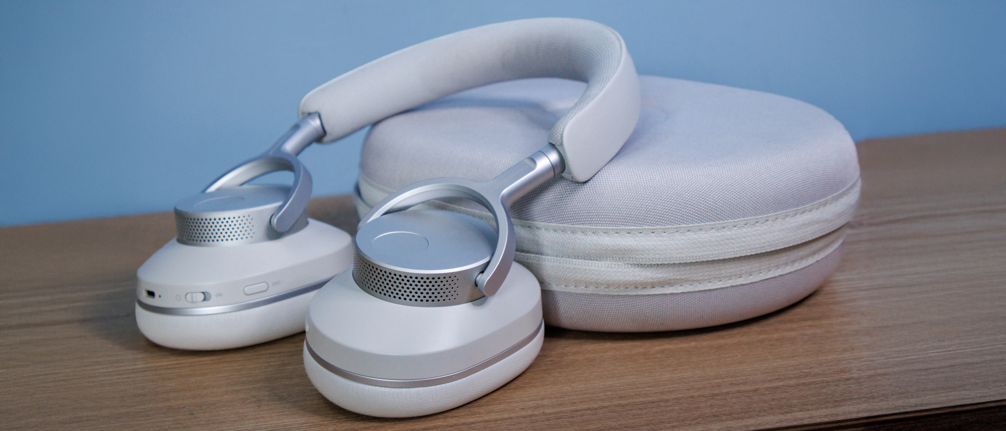 Cambridge Audio Melomania P100 SE headphones and case on a table.