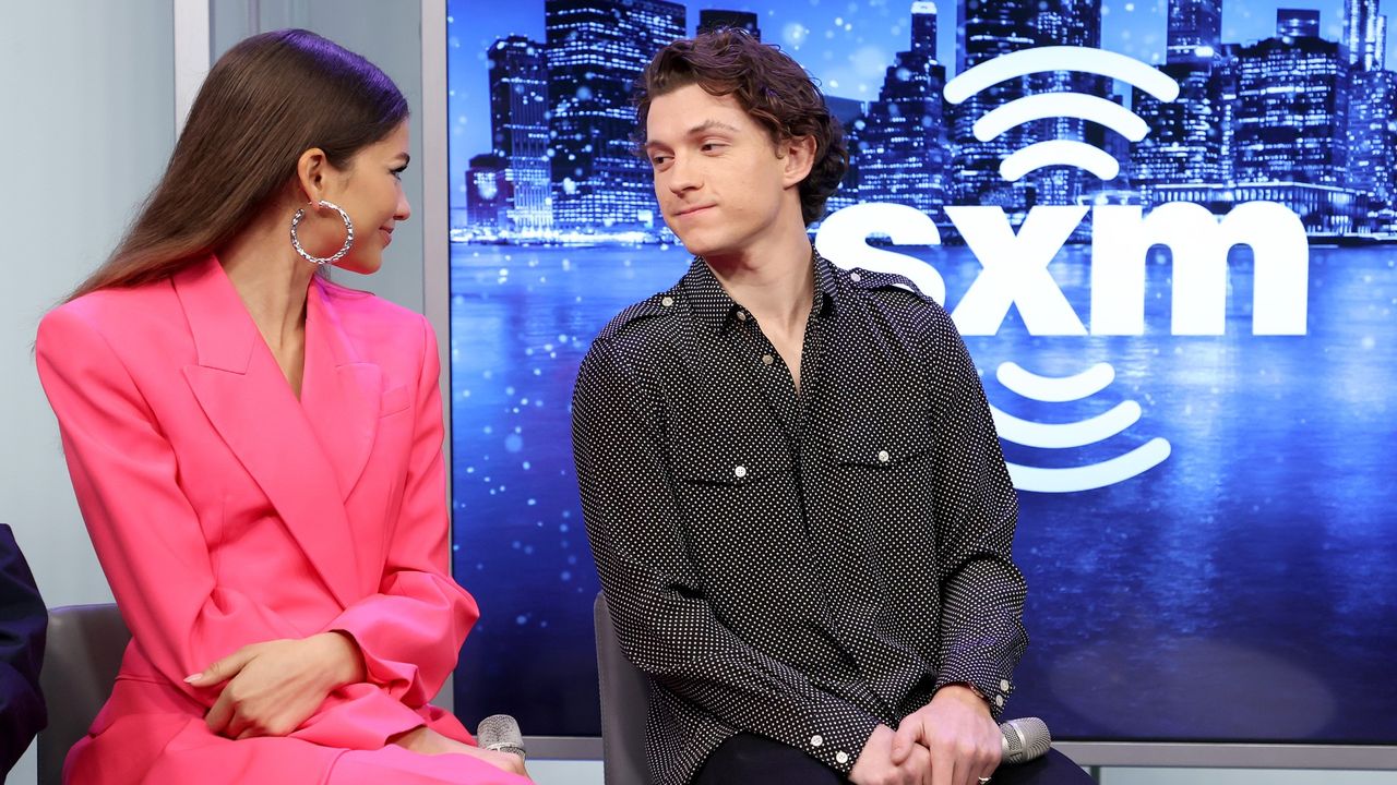 Tom Holland and Zendaya gaze at one another during a press call