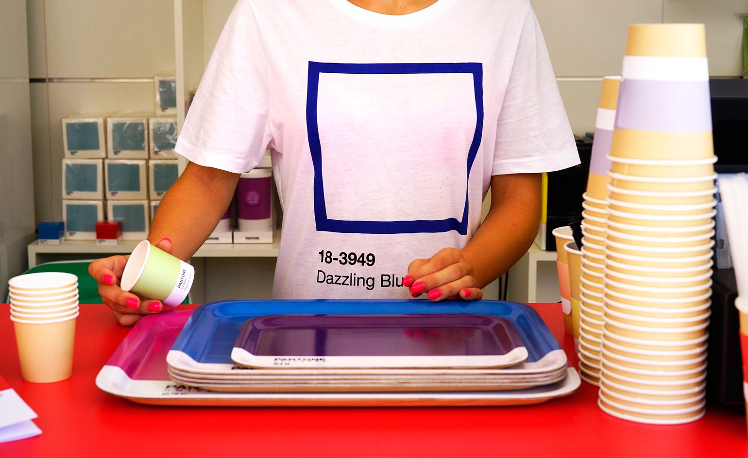 The waiter arranging the glasses and tray