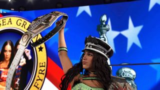 Chelsea green raises a belt as she enters the ring in WWE 2K26
