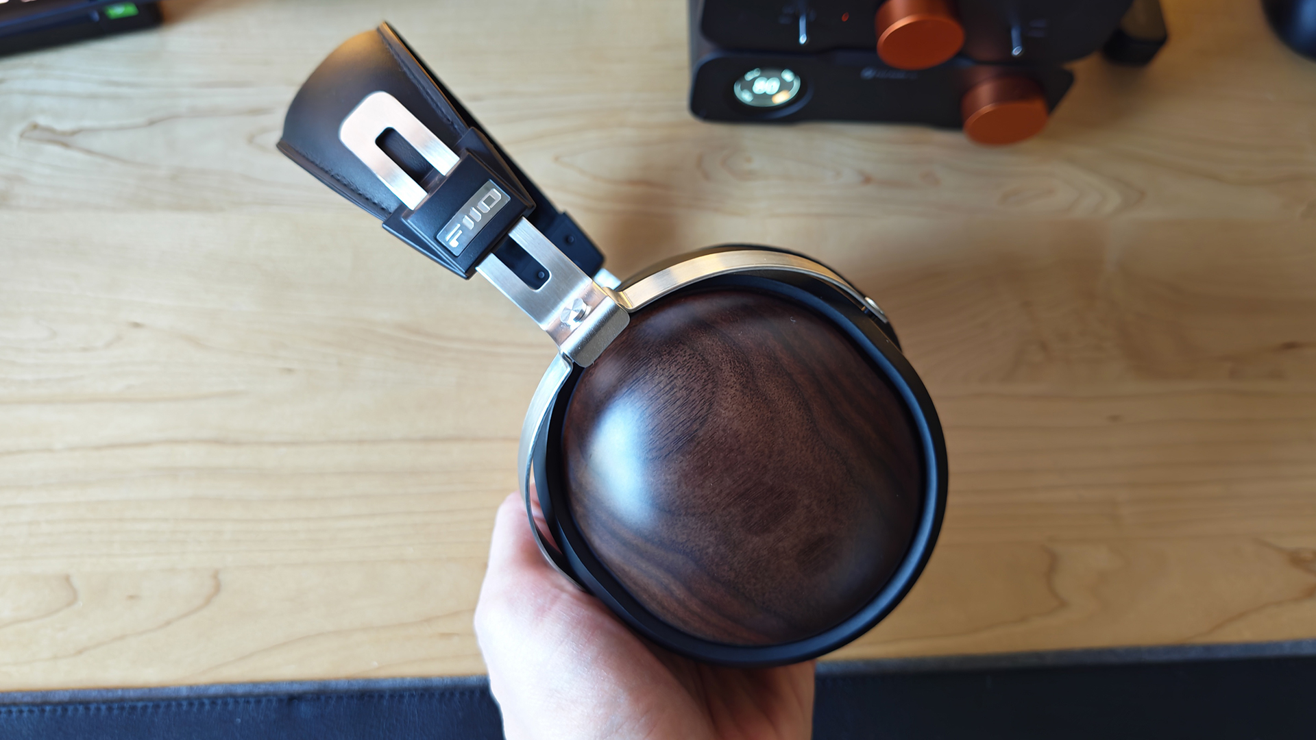 Various photos of the FiiO FT1 headphones, in a home office. 