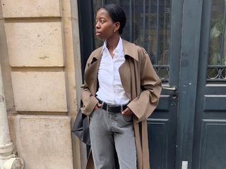 Girl in Paris wearing trench coat