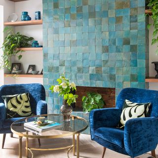 living room with blue armchair with cushions