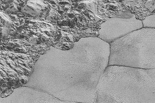 Pluto's Mountains Meet the Vast Plain
