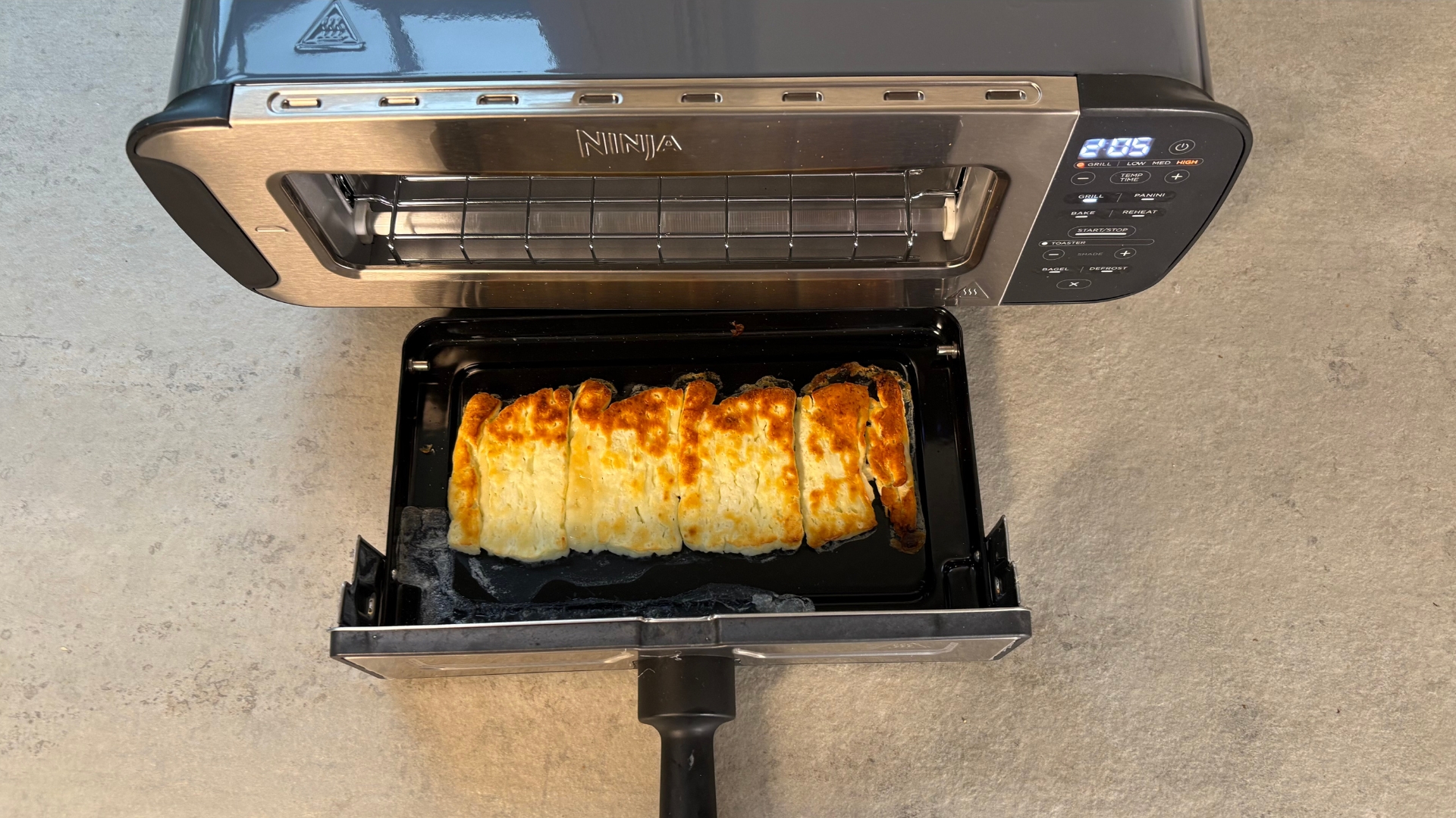 Testing the Ninja Foodi 3-in-1 Toaster Grill Panini Press on the counter grilling halloumi
