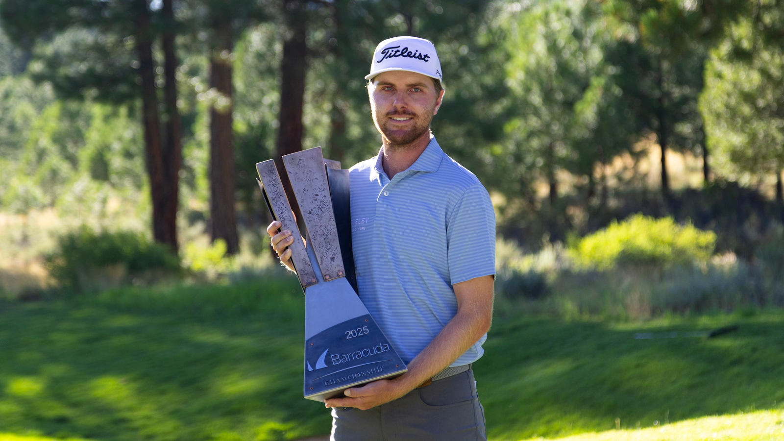 Ryan Gerard holds the Barracuda Championship trophy