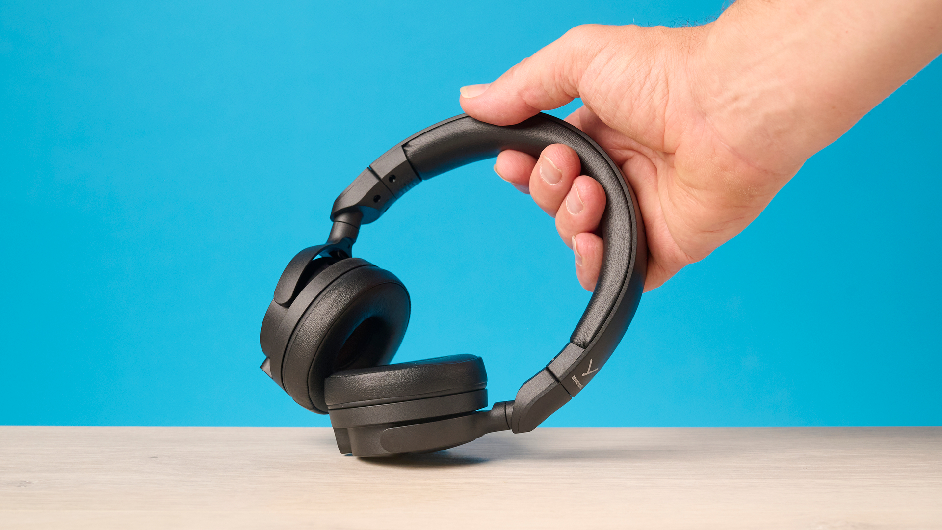 Beyerdynamic DT 275 Pro photographed in front of a blue background