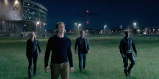 Avengers: Endgame some Avengers standing in a field, looking towards the sky