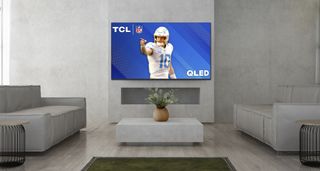 TCL Q651G-Pro QLED TV on living room wall