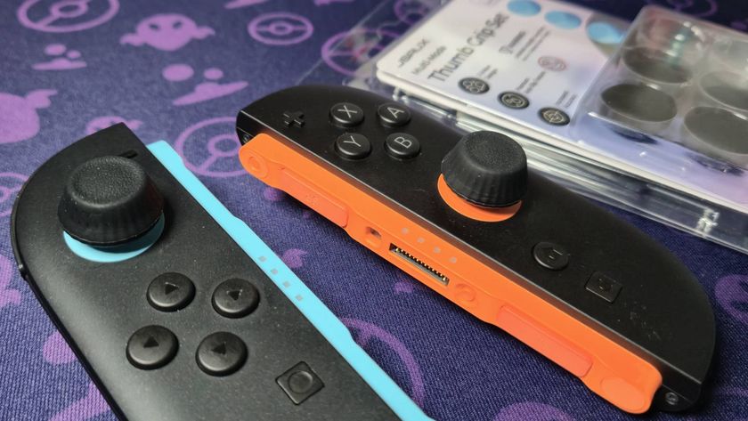 Photo of a pair of black high-rise thumb grips on the Switch 2 Joy-Con.