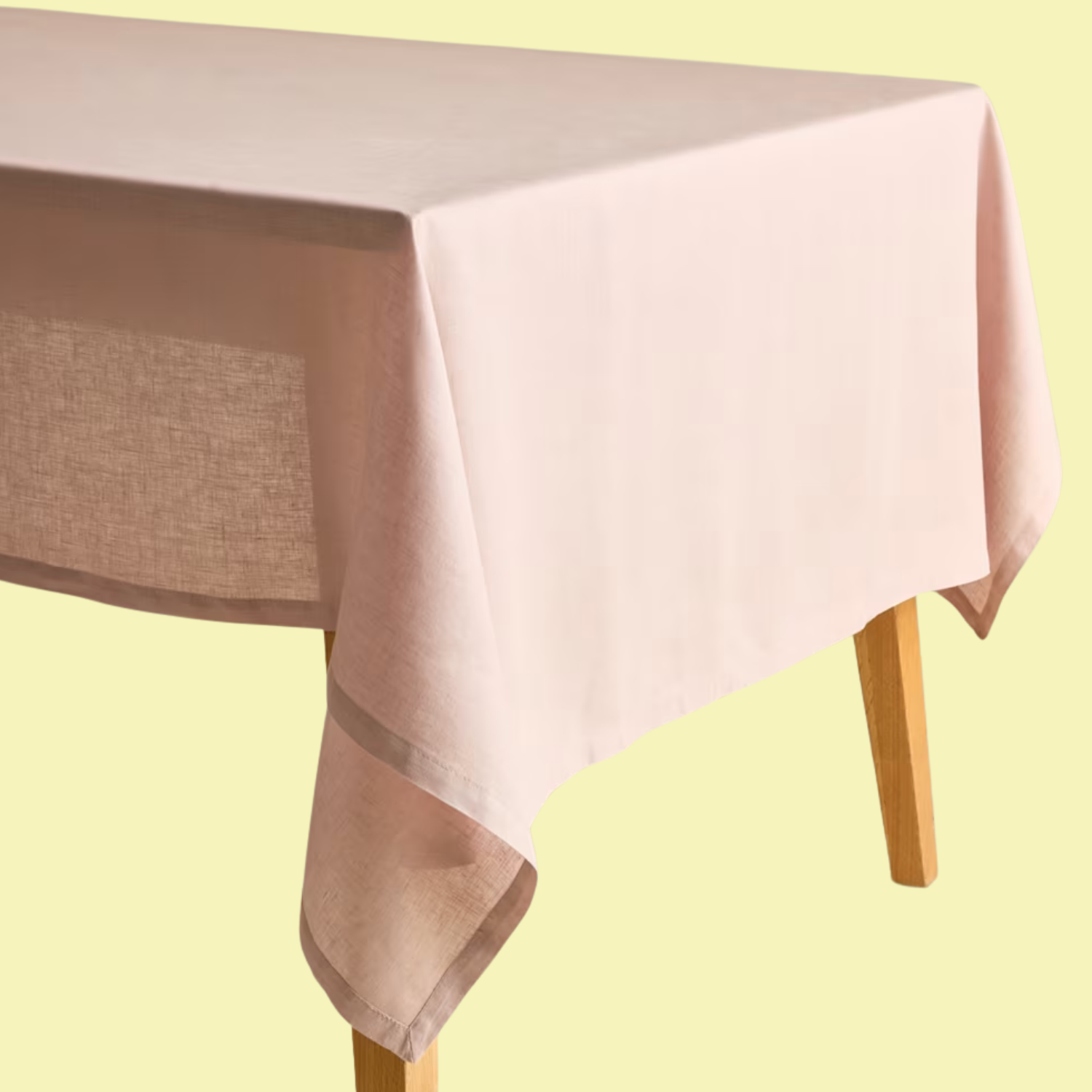 A table with a pink linen tablecloth