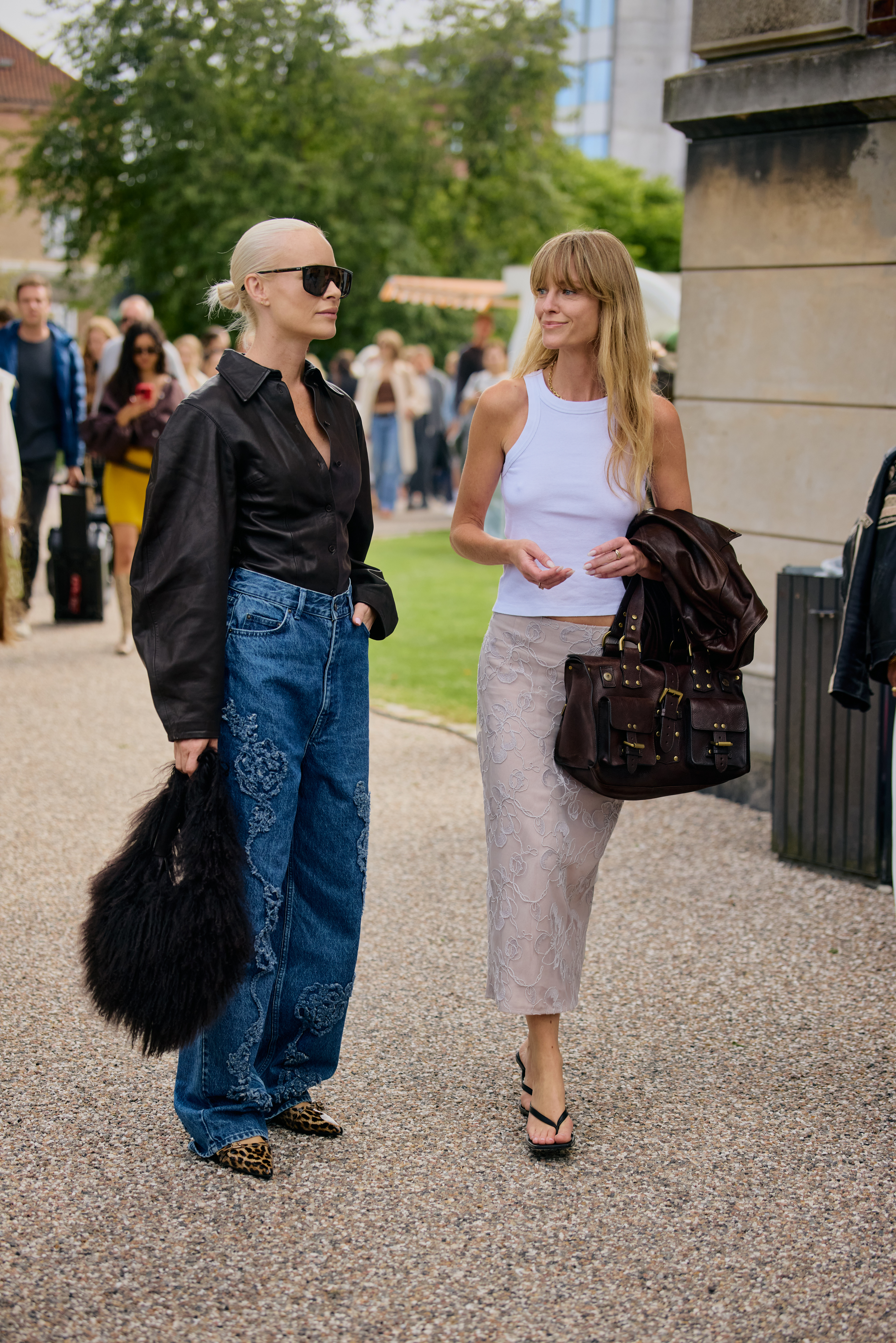 Copenhagen Fashion Week attendees wear animal print shoes.