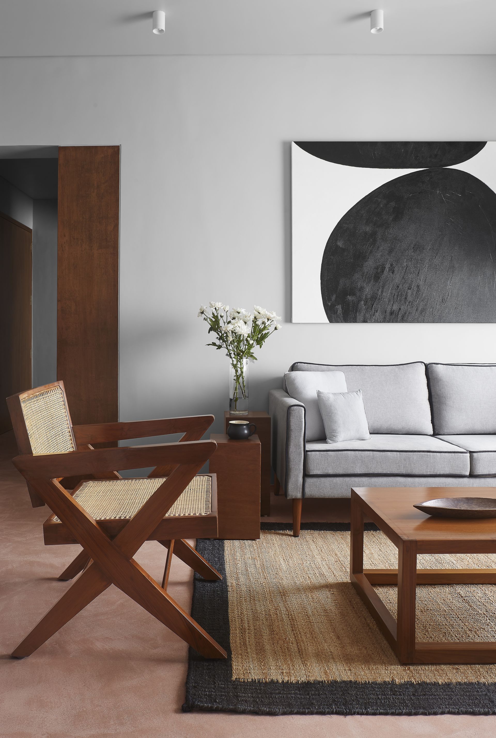 A small living room with a large artwork