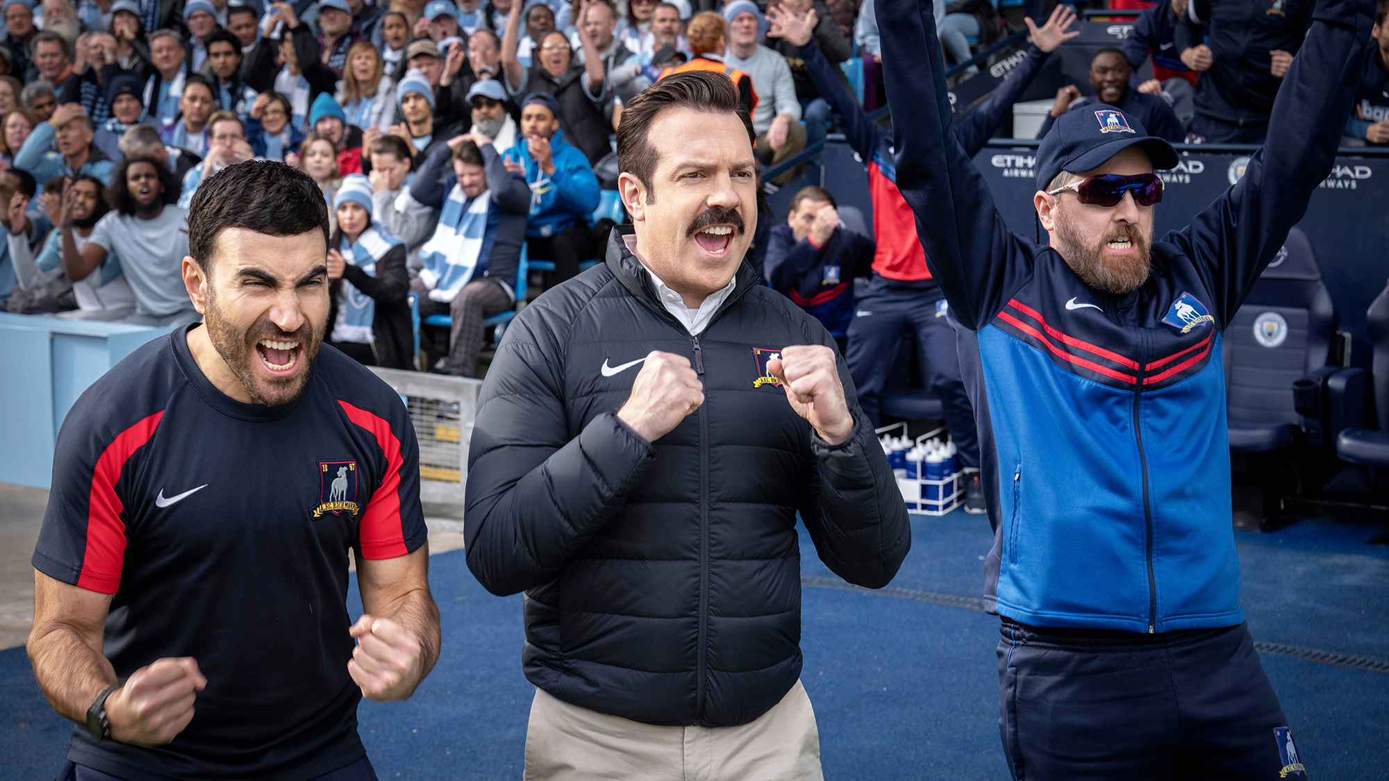 (L to R) Brett Goldstein as Roy Kent, Jason Sudeikis as Ted Lasso, and Brendan Hunt as Coach Beard in Ted Lasso season 3