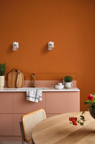 A dining room drenched in orange color