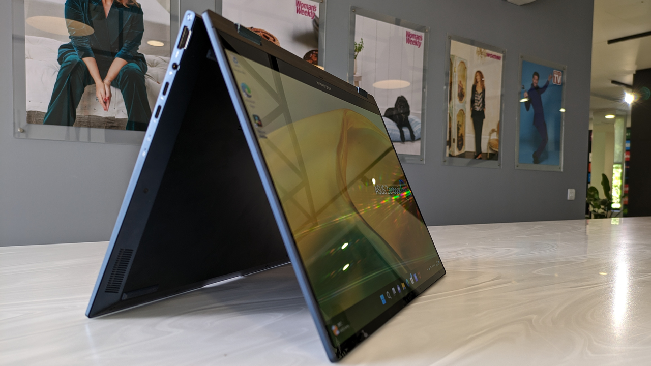 The Asus Zenbook 14 Flip OLED on a white surface