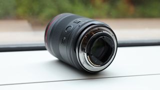 Canon RF 35mm f/1.4L VCM lens on a white surface in front of a window