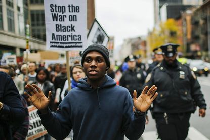 A protestor takes part in an October march in New York against police brutality 