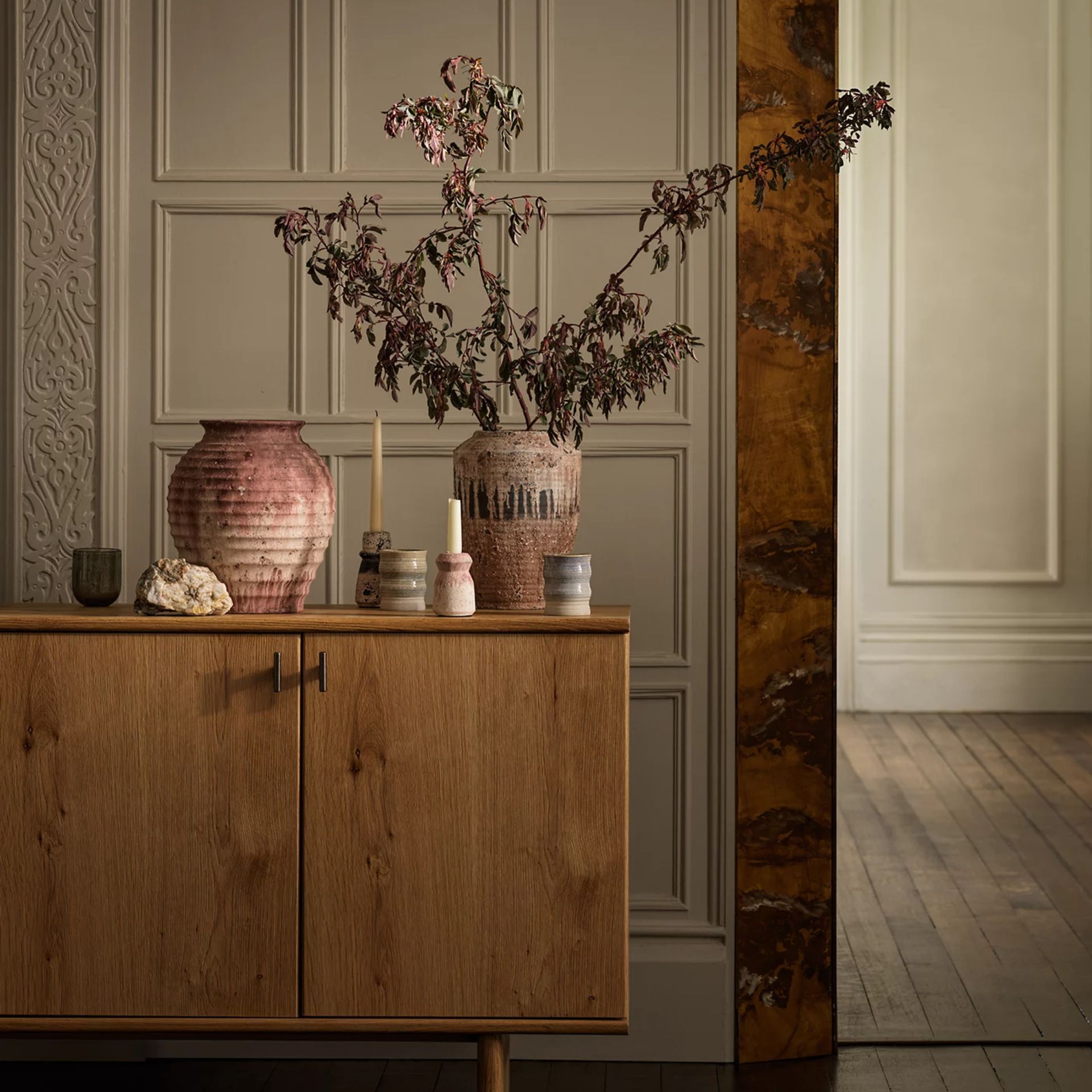 Large textured vase on side console table