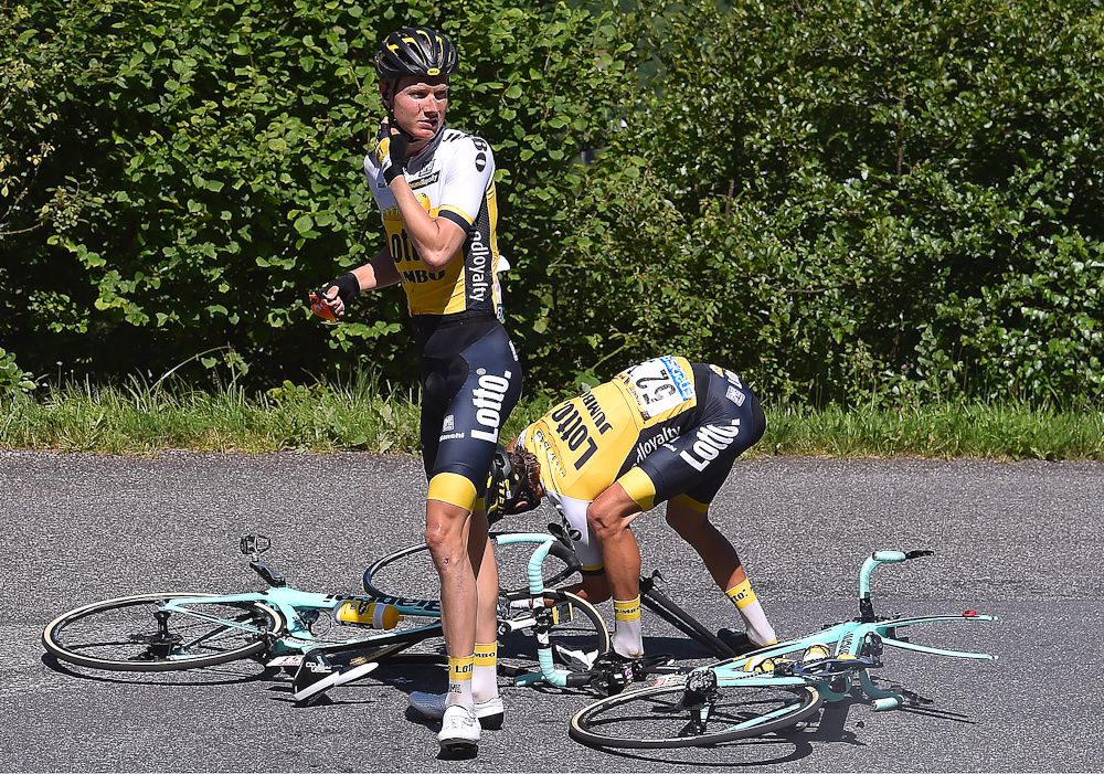 Wilco Kelderman and George Bennett wait for help from the team car during stage 8 at the Tour de France