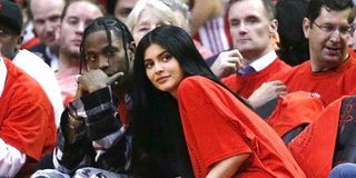 Travis Scott and Kylie Jenner at a basketball game.