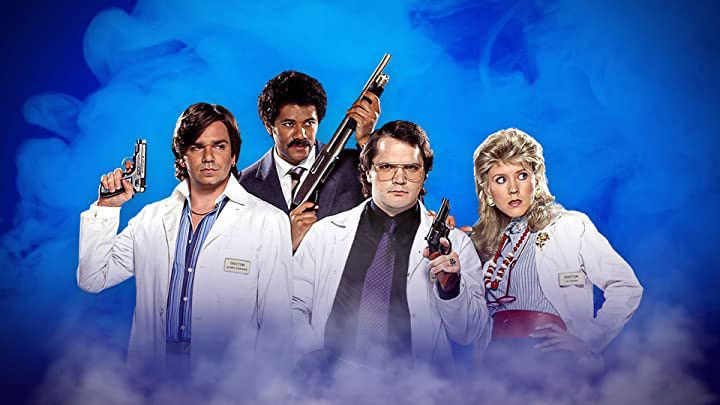 The cast of Garth Marenghi&#039;s Darkplace, holding guns. 